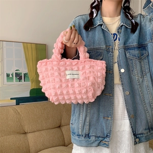 Detail of pink bubble texture canvas handbag with Love Sozakka woven label