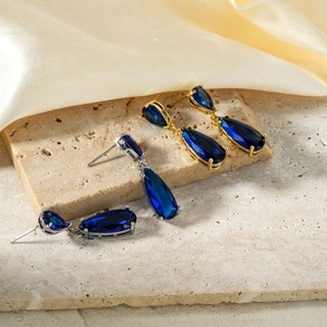 Elegant vintage pear-cut blue zircon drop earrings with gold and silver base on stones