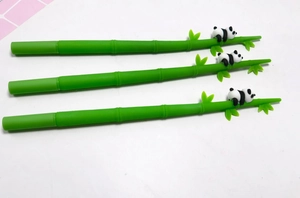 Detail of bamboo shaped pens with cute 3D panda figures on top for creative stationery