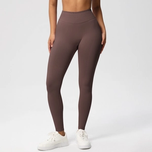 Detailed macro view of the high-waist seamless compression band on coffee yoga leggings