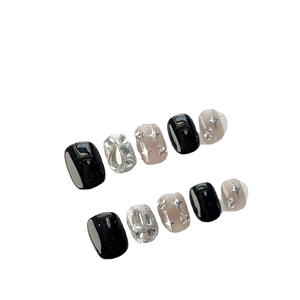 Handmade press-on nails with black gradient, silver stars and rhinestones set