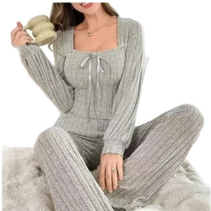Women's grey ribbed knit lounge set featuring long sleeve square neck top and wide leg pants