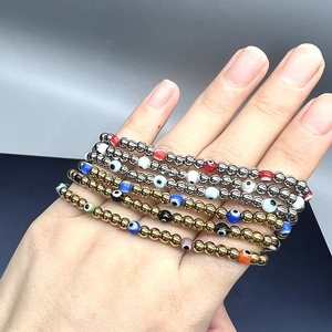 18K gold plated titanium steel beads bracelet with colorful evil eye charms on wrist