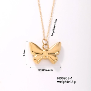 Detailed view of golden butterfly necklace showing dimensions 2.2cm x 1.6cm and chain length