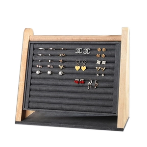 Wooden jewelry display stand with dark grey velvet slots for rings and earrings