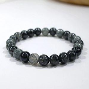 Detailed view of natural grey agate beads with unique crackle texture on elastic bracelet