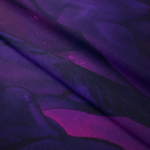 Close-up of soft purple microfiber fabric showing smooth texture and artistic whale print