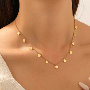 Minimalist gold plated stainless steel necklace featuring multiple heart shaped pendants