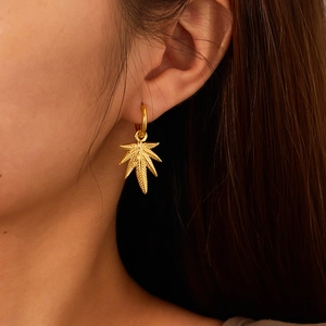 Elegant gold maple leaf hoop earrings for women made of durable titanium steel