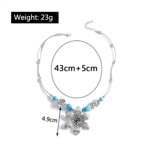 Ethnic silver necklace with turquoise beads and flower pendant showing 43cm+5cm dimensions