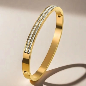 Luxurious 18K gold plated titanium steel bracelet featuring double rows of square zircons