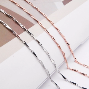 Macro shot of parallel silver and rose gold S925 sterling silver chain link necklace details