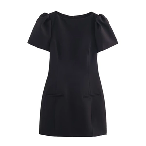 Minimalist black short sleeve mini dress with puff sleeves and decorative pockets