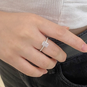 Detailed view of an S925 sterling silver ring with a rectangular ice-cut zircon on a finger