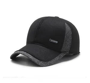 Detail of winter baseball cap featuring grey tweed fabric and metal Sport badge