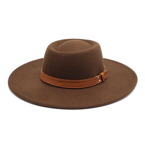 Detailed view of the caramel wool fedora hat featuring a leather band with silver rivets