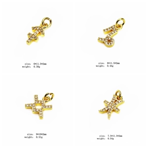 Macro view of gold zodiac charms with cubic zirconia inlay and detailed size parameters