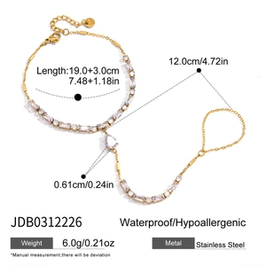 Detail of gold stainless steel finger bracelet with cubic zirconia and size dimensions