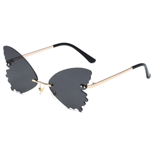 Fashionable rimless butterfly shaped sunglasses with gold metal frame and dark grey lenses