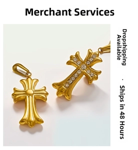 Detail view of 18k gold cross pendants in polished and rhinestone-set styles