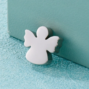 Polished silver angel locket necklace pendant on a light blue gift box background