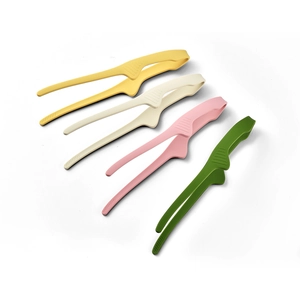 Set of four colorful silicone food tongs for BBQ and baking on a clean white background