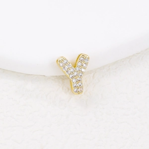 Detailed macro view of a gold-plated bubble letter Y pendant inlaid with zircon crystals