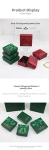 Detail of elegant bow jewelry gift box featuring textured finish and clover necklace inlay