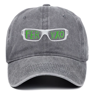 Detailed view of the 3D green FERXXO embroidery on a vintage washed dark grey baseball cap
