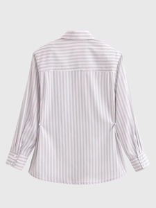 Detail of vertical and horizontal stripes on the back of a padded shoulder shirt