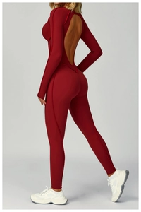 Deep red yoga jumpsuit with open-back V-cut and textured ribbed fabric for fitness