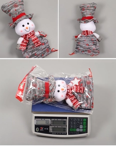 Détail du sac cadeau de Noël bonhomme de neige avec étoile à paillettes et son poids
