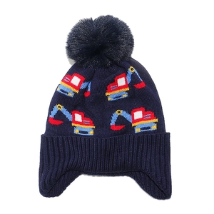 Winter knit earflap hat for kids featuring colorful excavator patterns and a blue faux fur pom