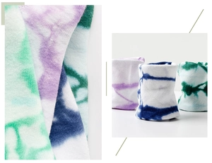 Detailed macro view of tie-dye cotton socks in vibrant purple blue and green tones