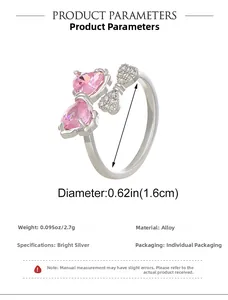 Detail showing ring size dimensions with pink heart zircon and bow tie elements