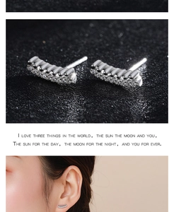 Detail view of 925 sterling silver double-row micro-pave stud earrings on model and close-up