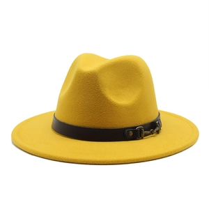Close-up of bright yellow wool fedora hat featuring a black leather belt with metal buckle