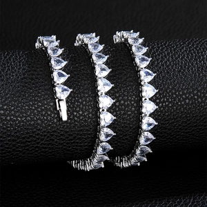 Macro shot of silver heart-cut zircon tennis chain with a secure insertion clasp closure