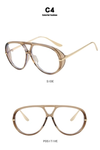 Detail view of retro double bridge aviator sunglasses with amber frame and gold metal temples