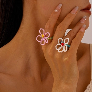 Handmade floral beaded rings for women featuring colorful pink and white petals