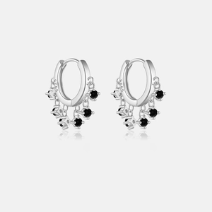 Detail of S925 sterling silver hoop earrings with hanging black zircon stone pendants