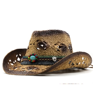 Close-up of a woven straw cowboy hat with bohemian beaded band and turquoise stone detail