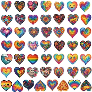 Macro view of various heart-shaped stickers with colorful artistic patterns in grid layout