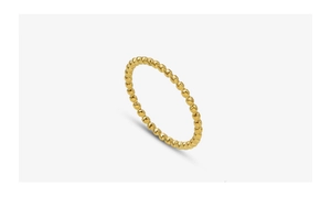 Close-up of golden beaded textured ring in minimalist 18k gold plated titanium steel