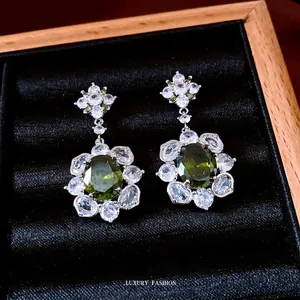 Vintage court style floral earrings with emerald green zircon and silver needles