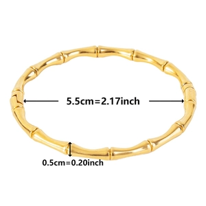 Detail view of gold bamboo style bracelet with 5.5cm inner diameter and 0.5cm thickness