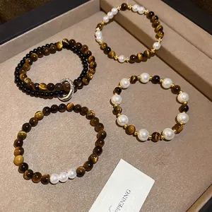 Vintage tiger eye and pearl beaded bracelets with horseshoe charm in warm brown tones