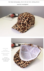 Detailed interior and side view of washed leopard print denim baseball cap for unisex