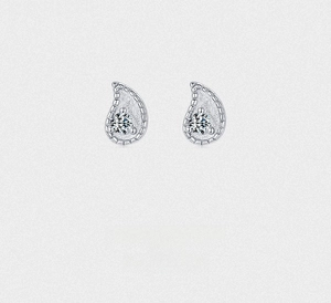 Close-up of teardrop silver stud earrings with sparkling cubic zirconia inlay