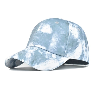 Detailed view of blue and white cloud-pattern tie-dye cotton canvas baseball cap